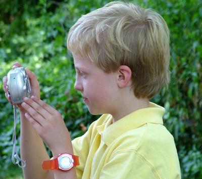 boy-taking-a-picture-outside