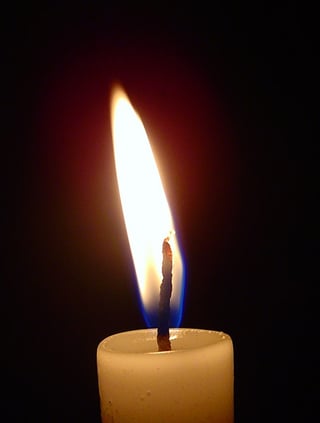 lit-candle-in-the-dark lit-candle-in-the-dark