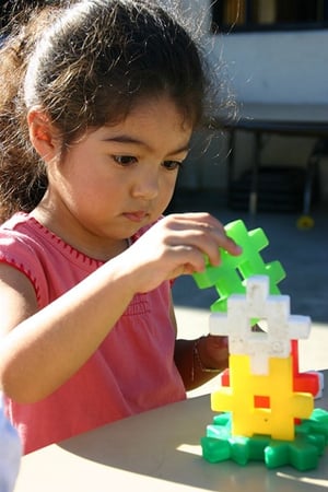 girl-playing-with-stackable-toys