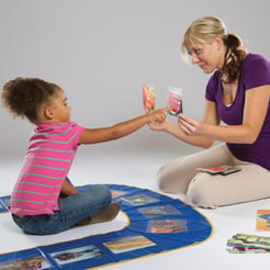 woman using Stages Learning U-Play Mat with autistic girl