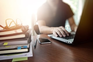 designer hand working with digital tablet and laptop and notebook stack and eye glass on wooden desk in office.jpeg designer hand working with digital tablet and laptop and notebook stack and eye glass on wooden desk in office.jpeg