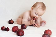 infant with autism eating fruit