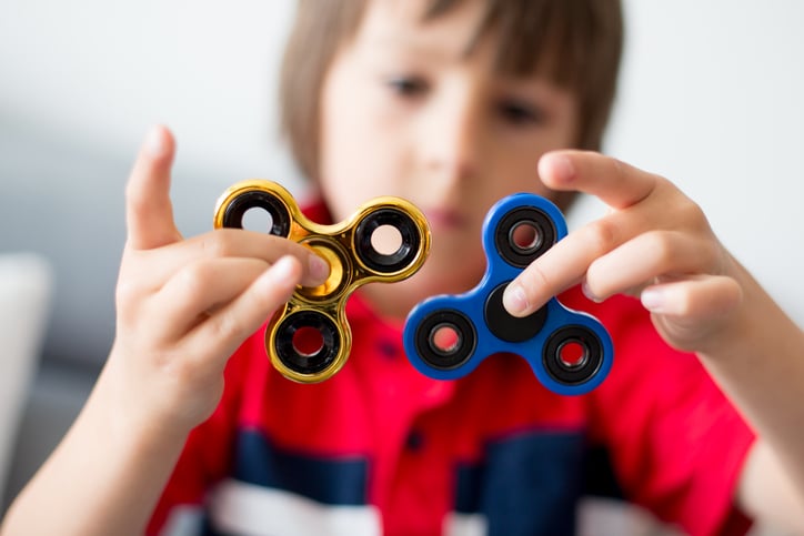 child-playing-with-fidget-spinners