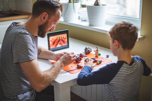 father-son-using-arts-and-crafts-example-to-do-an-art-project