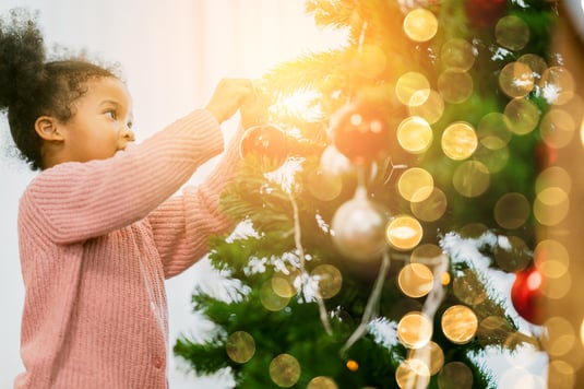 girl with autism by christmas tree