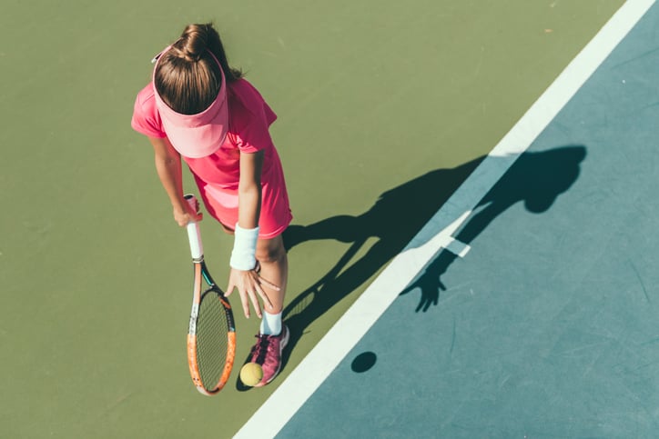 girl with autism playing tennis