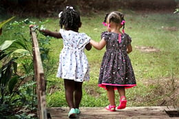 two-young-girls-holding-hands
