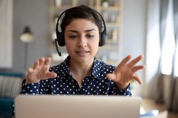 girl-wearing-quality-headset-and-camera-for-teletherapy