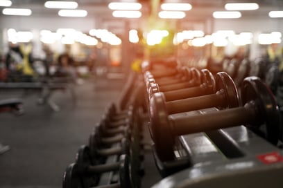 gym-weights-equipment-with-bright-lights