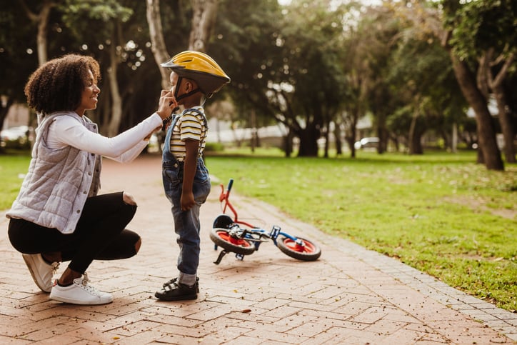 boy with autism getting ready to ride his bike