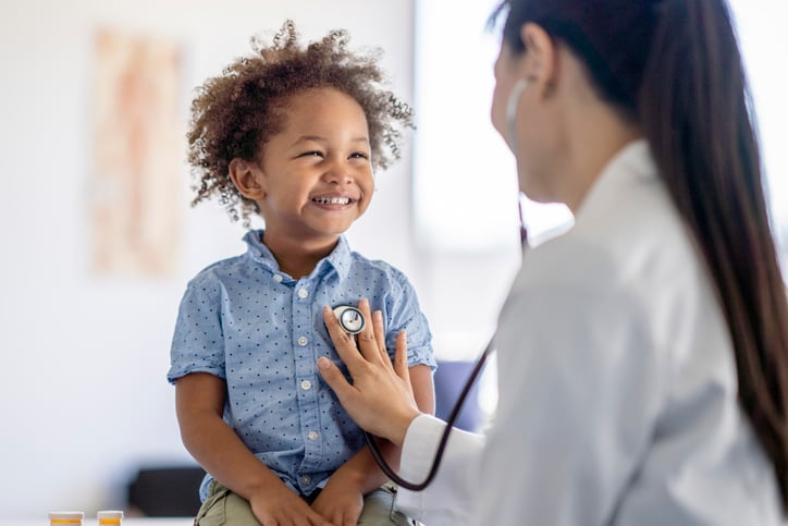 doctor checking heartbeat