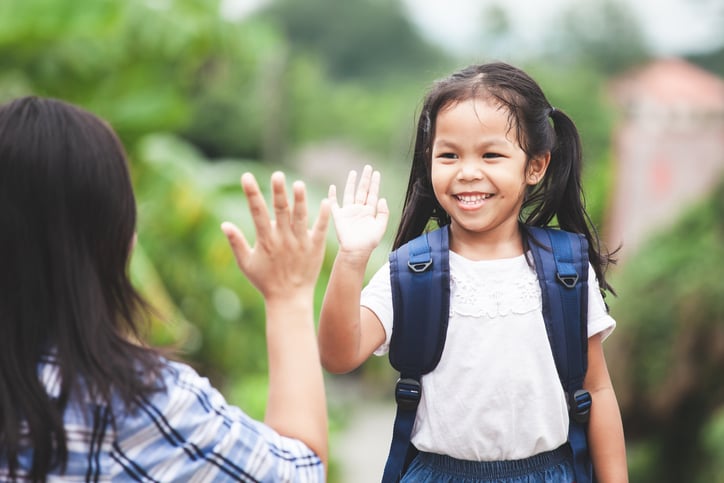 girl with autism about to high five